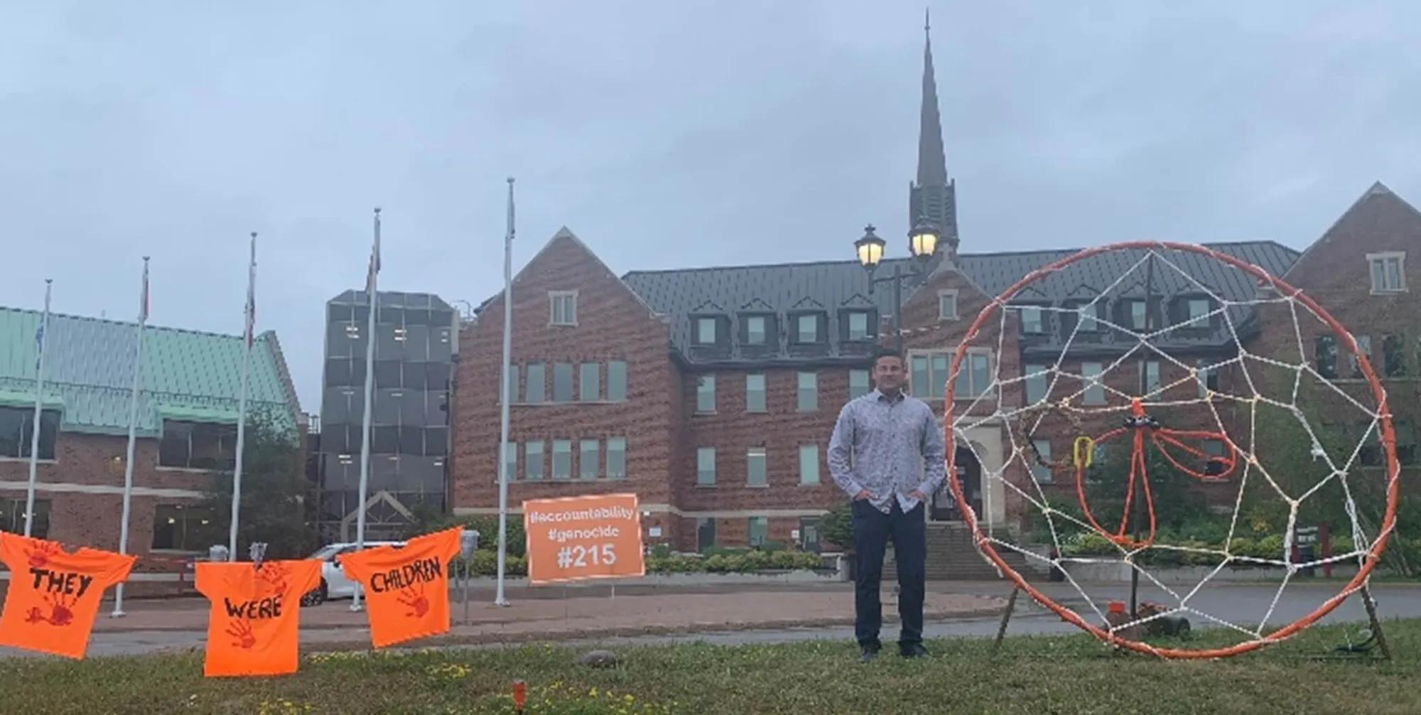 Matt Neveu in front of the original Shingwauk Residential School