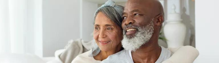 Elderly couple sitting together