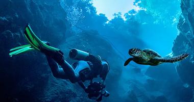 Two scuba divers in deep blue water