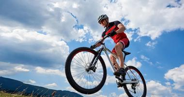 person on mountain bike going uphill